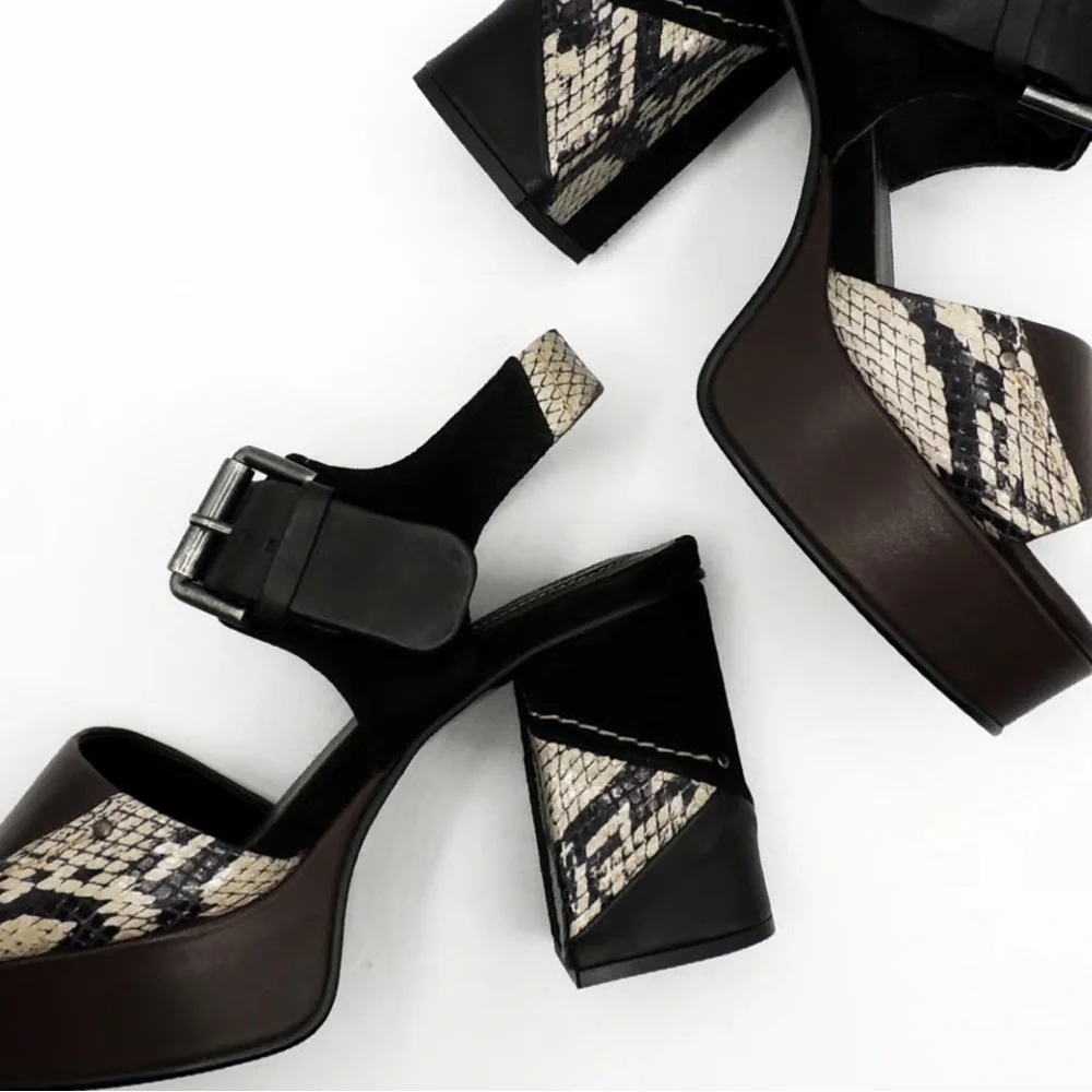 See by Chloe . Black , brown and python print platform heels.